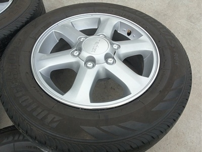 ขายล้อแม็กISUZU GOLD seriesขอบ16 พร้อมยาง215/65/16 ปี 13 4 ล้อ