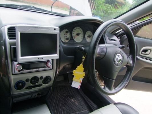 MAZDA 323 Protege ปี 2004 Auto เครื่องแน่นๆไม่เยิ้ม ช่วงล่างหนึบๆ มือสองแท้ ชุดแต่งรอบคันโรงงาน แมกซ์ขอบ 15 นิ้ว โรงงาน มี abs airbag 2 ลูก รีโมท เบาะหนัง กระจกไฟฟ้า ปรับข้างไฟฟ้า