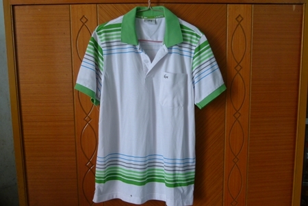 เสื้อโปโล  สีขาว ปกคอเขียว  ไซร์ L   ไม่เคยใส่ ครับๆ สภาพใหม่ 100 \%