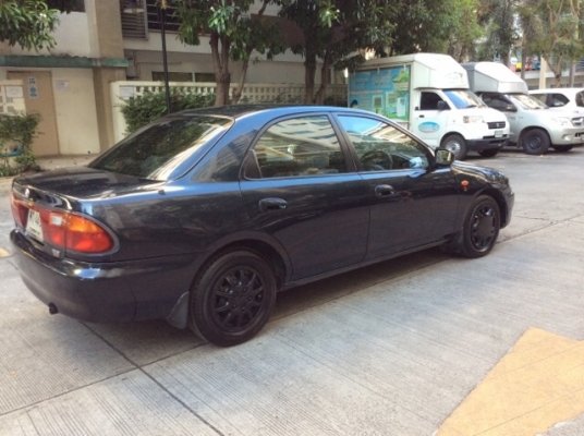 ขายรถมาสด้า 323 ซีดาน ปี 96 เครื่องเดิม 1.6 หัวฉีด เกียร์ธรรมดา ติดแก๊ส LPG  ภายในเดิมๆสวยมาก เบาะกำมะหยี่เดิมๆสะอาด เครื่องเสียง CD/จอทีวี LCD 7&quot; ซับเบส 10&quot; ใช้ได้หมด  กระจกไฟฟ้าทั้งคัน เพาเวอร์ แอร์เย็นฉ่ำ ตัวถังบางๆเดิมๆทั้งคัน สีสวยเงา รถสวย