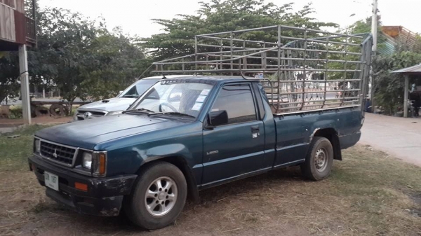 ขายรถกระบะมิตซู พร้อมคอกเหล็กบรรทุกวัว เครื่องดี แชชซีสวย เอกสารเล่มทะเบียนพร้อมโอน ทะเบียนเต็มปี58