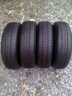 ขายยางป้ายแตงใหม่ๆ บริสโตร์ยางปี 5012 ขนาด 175/70R14 พร้อมกะทะเหล็ก 4 รู และฝาNISSAN ALMERA และน๊อต 16 ตัว  รวม  1 ชุด  4 เส้น