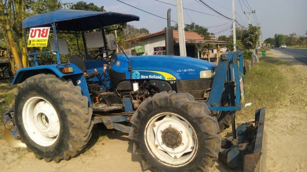 newholland    T55 พร้อมใช้  แถมดันหน้า+ผาน6x26"TT (((อยู่ไกลมีรถขนส่งบริการครับ))