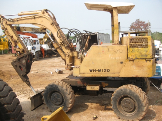 รถแบคโฮล้อยาง ติดหัวเบรกเกอร์