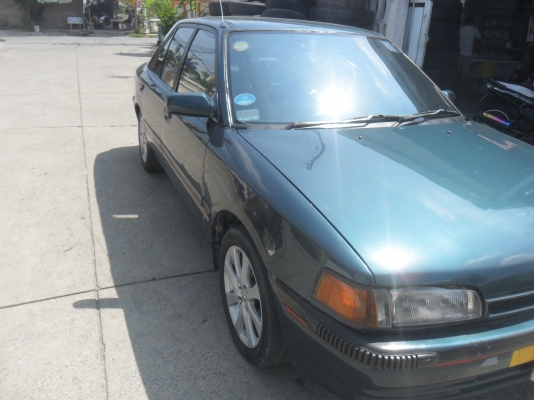 รถมาสด้า 323 1.3 สีเขียว ติดแก๊สลงเล่มแล้ว พร้อมใช้ ราคา 43000 บาท