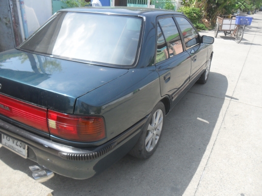 รถมาสด้า 323 1.3 สีเขียว ติดแก๊สลงเล่มแล้ว พร้อมใช้ ราคา 43000 บาท