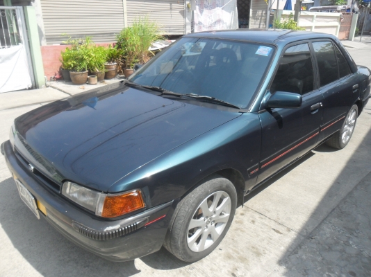 รถมาสด้า 323 1.3 สีเขียว ติดแก๊สลงเล่มแล้ว พร้อมใช้ ราคา 43000 บาท