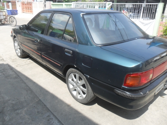 รถมาสด้า 323 1.3 สีเขียว ติดแก๊สลงเล่มแล้ว พร้อมใช้ ราคา 43000 บาท