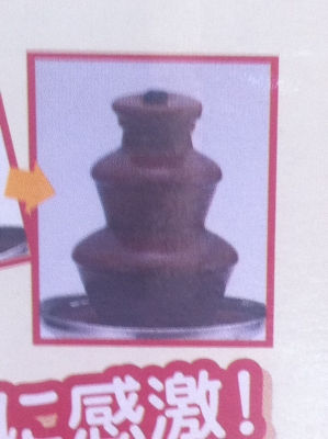 เครื่องอุ่นและหมุนปํ้มช็อกโกแลตไหลตกลงมาเป็นชั้นๆอย่างสวย