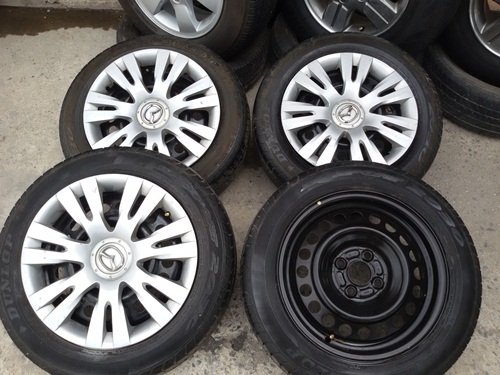 ขายล้อกะทะขอบ15 MAZDA 4รู100 พร้อมยางและฝาครอบ 4 ล้อ