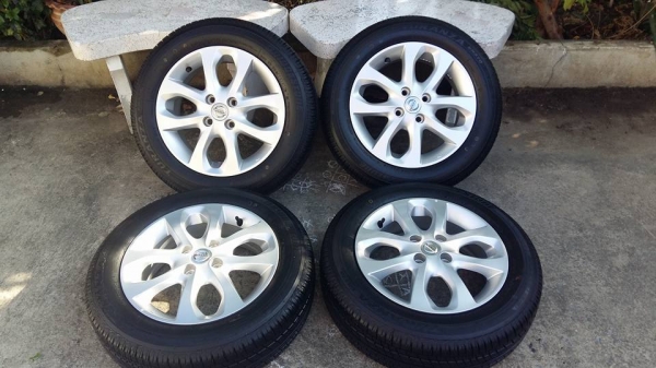 ขายล้อแม็กป้ายแดง nissan march mc 15"พร้อมยางปี15 สนใจติดต่อเล็กคลองสามครับ 081-3747940