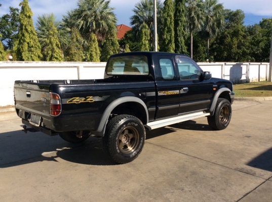 ขายรถกระบะฟอร์ด เรนเจอร์โฟวิลแคปเปิดได้ ปี03 เครื่องวาง 1JZ เทอร์โบ เกียร์ธรรมดา ติดแก๊สLPG ระบบเกียร์โฟวิลยังอยู่ครบ เพาเวอร์ ไฟฟ้า airbag/abs ภายในเดิมๆวิทยุCD ตัวถังบางเดิมทั้งคันสีเงามีริ้วรอย แม็กสวย8"ยางโฟ34" ยางดี โช๊คอัพแต่ง คัสซีสวย รถข