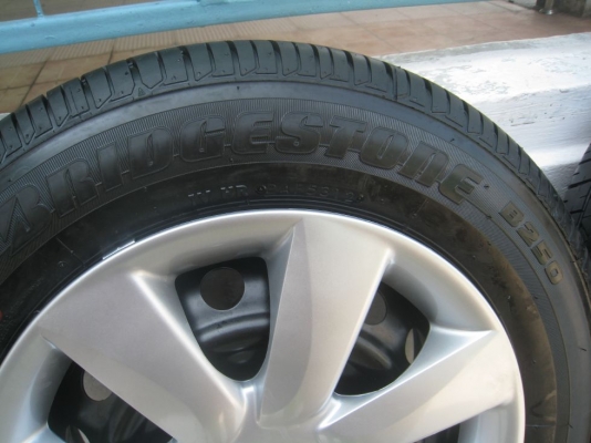 ขายกะทะล้อ nissan almera ขอบ14  4/100 +ฝาครอบ + ยางธันวาคมปี12 (081-3747940)