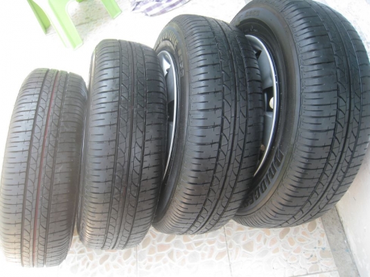 ขายกะทะล้อ nissan almera ขอบ14  4/100 +ฝาครอบ + ยางธันวาคมปี12 (081-3747940)