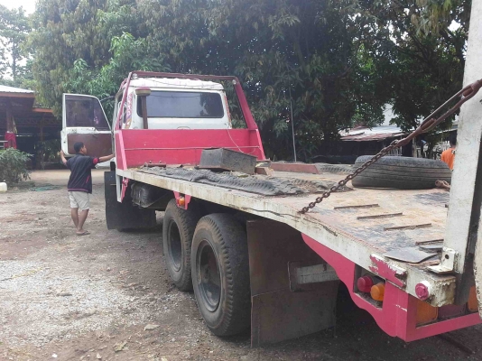 รถเกี่ยวข้าวพร้อมรถเทรเลอร์บรรทุก