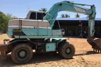 แบคโฮล้อยาง KOBELCO SK100W พร้อมหัวเจาะ +ปุ้งกี๋เอกสารเล่มทะเบียน