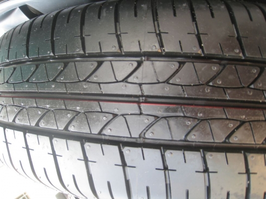 ขายกะทะล้อ nissan almera ขอบ14  4/100 +ฝาครอบ + ยางธันวาคมปี12 (081-3747940)