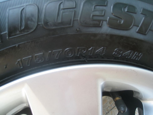 ขายกะทะล้อ nissan almera ขอบ14  4/100 +ฝาครอบ + ยางธันวาคมปี12 (081-3747940)