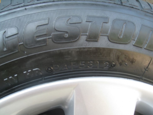 ขายกะทะล้อ nissan almera ขอบ14  4/100 +ฝาครอบ + ยางธันวาคมปี12 (081-3747940)