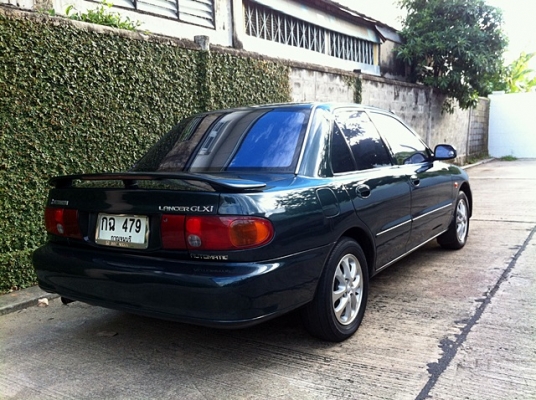 Mitsubishi LANCER 1.5GLXI AUTO โฉมสุดท้ายก่อนเปลี่ยนโฉม กันชนยื่น Mitsubishi LANCER 1.5GLXI AUTO โฉมสุดท้ายก่อนเปลี่ยนโฉม กันชนยื่น