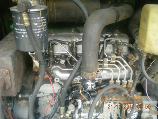 ต้องการขายรถแบคโฮ Nisan Hanix H 27 คอนโทรนน้ำมัน พร้อมลายหัวเจาะ