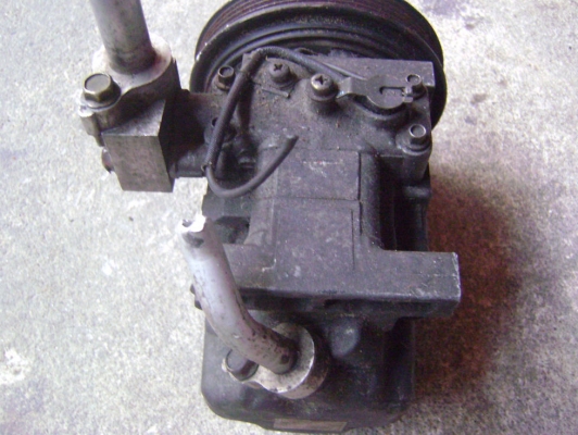 คอมแอร์ mazda 323 ไฟป็อบอัพ