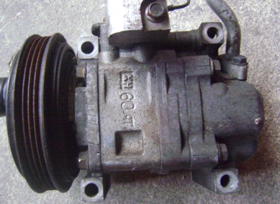 คอมแอร์ mazda 323 ไฟป็อบอัพ