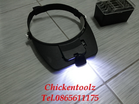 แว่นขยายสวมหัว  มีเลนส์ให้ 4 ขนาด 1.2X , 1.8X , 2.5X , 3.5X มีช่องใส่เลนส์ 2 ช่องเพิ่มอัตราขยายได้ มีไฟ LED 2 ดวง แสงสว่างมาก ไว้ใช้ส่องดูพระ ซ่อมงานอิเลคทรอนิกส์ และอิ่น ๆ