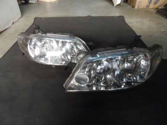 ขาย ไฟหน้ารถยนต์ ซีนอล มาสด้า 323 โปทีเจ้ Mazda 323 Protege xenon ของแท้นำเข้าจากญี่ปุ่น