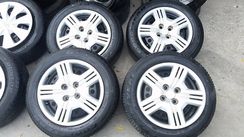 ขายล้อกะทะHONDA ขอบ15 4 รู100 พร้อมยางฝาครอบ 4 ล้อ