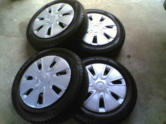 ขายล้อกระทะพร้อมยางและที่ครอบล้อ มิราจ ยาง Dunlop 165/65/14 ยางสัปดาห์ที่ 35/12 ลงพื้นไม่ถึง 500 โล