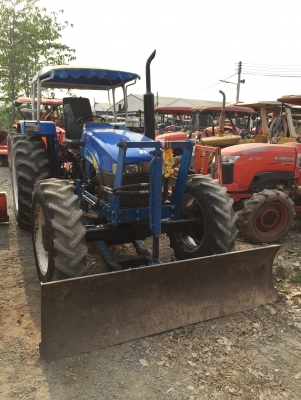 New Holland  TT75 พร้อมอุปกรณ์หน้าหลัง